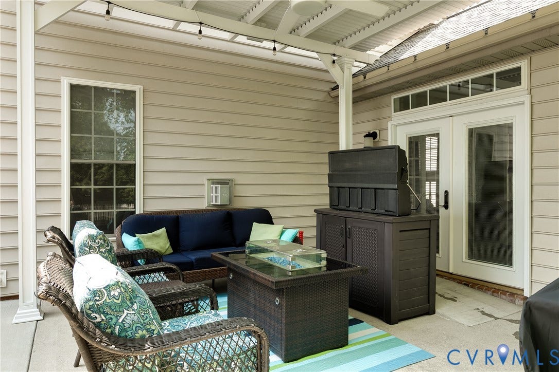 Patio Featuring Outdoor TV and Ceiling Fan.