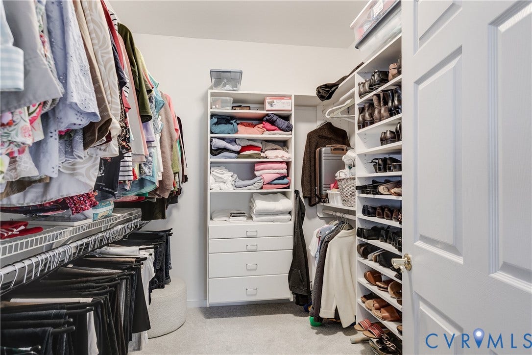 Primary Bedroom Featuring a Large Walk-In Closet.
