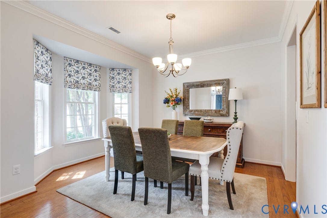 Dining Room Featuring Bay Windows.