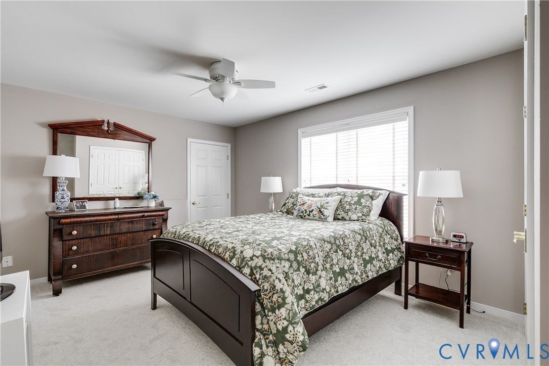2nd Floor Bedroom Featuring Carpet and Ceiling Fan.