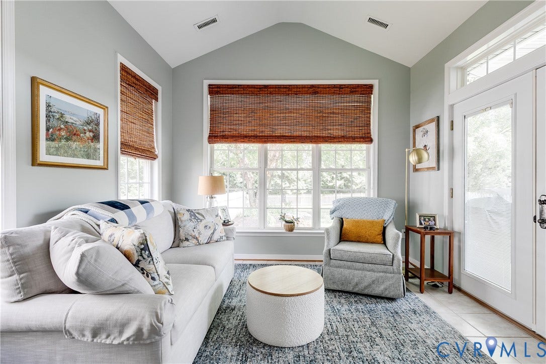 Florida Room Featuring Tile Flooring and Palladian Windows.