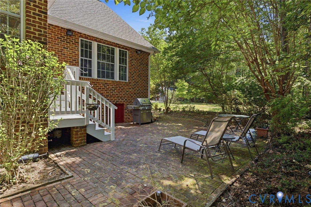 2065 Garrett Lane, Powhatan, VA 23139 Brick patio off of screened porch and deck.