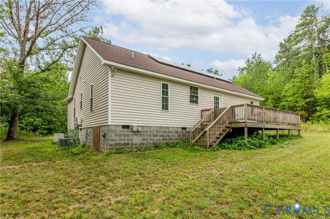 24580 St James Road, Amelia, VA 23083 Exterior featuring horizontal vinyl siding, a brown shingle roof, and solar panels