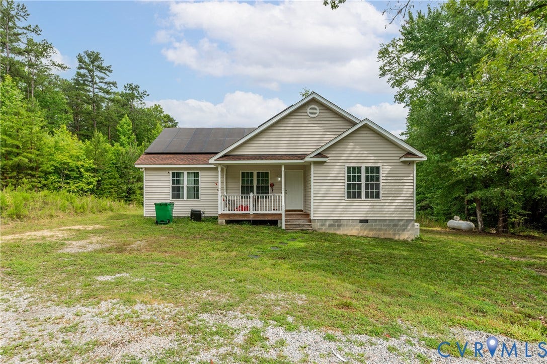 24580 St James Road, Amelia, VA 23083 Single-story residence featuring light-colored siding and a covered front porch