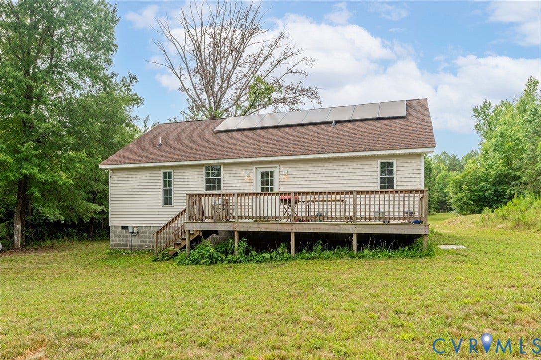 24580 St James Road, Amelia, VA 23083 Rear exterior with a spacious wooden deck featuring a wooden railing and stairs
