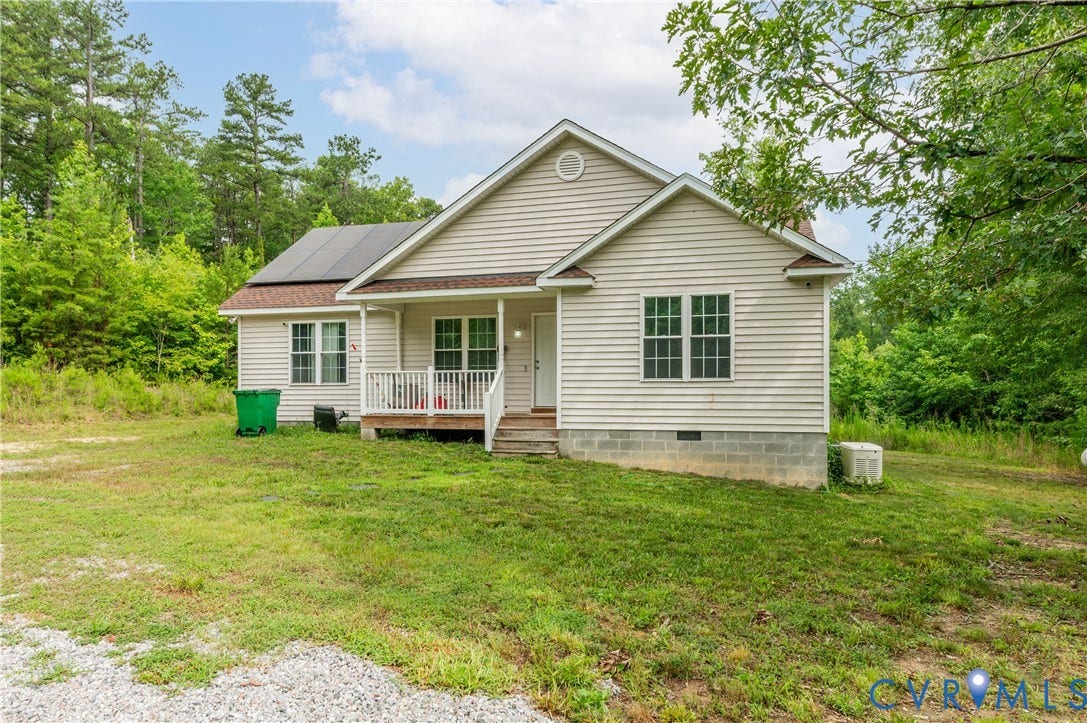 24580 St James Road, Amelia, VA 23083 Ranch-style exterior with light-colored siding, a covered porch, and solar panels