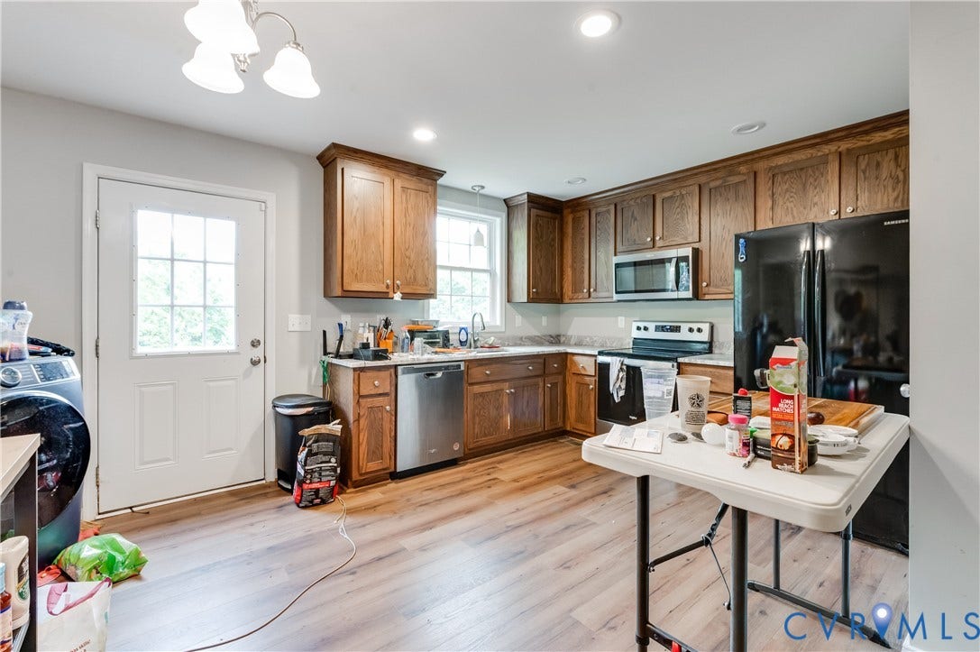 24580 St James Road, Amelia, VA 23083 Kitchen featuring wood-finish flooring, recessed lighting, and a white paneled door with window inserts