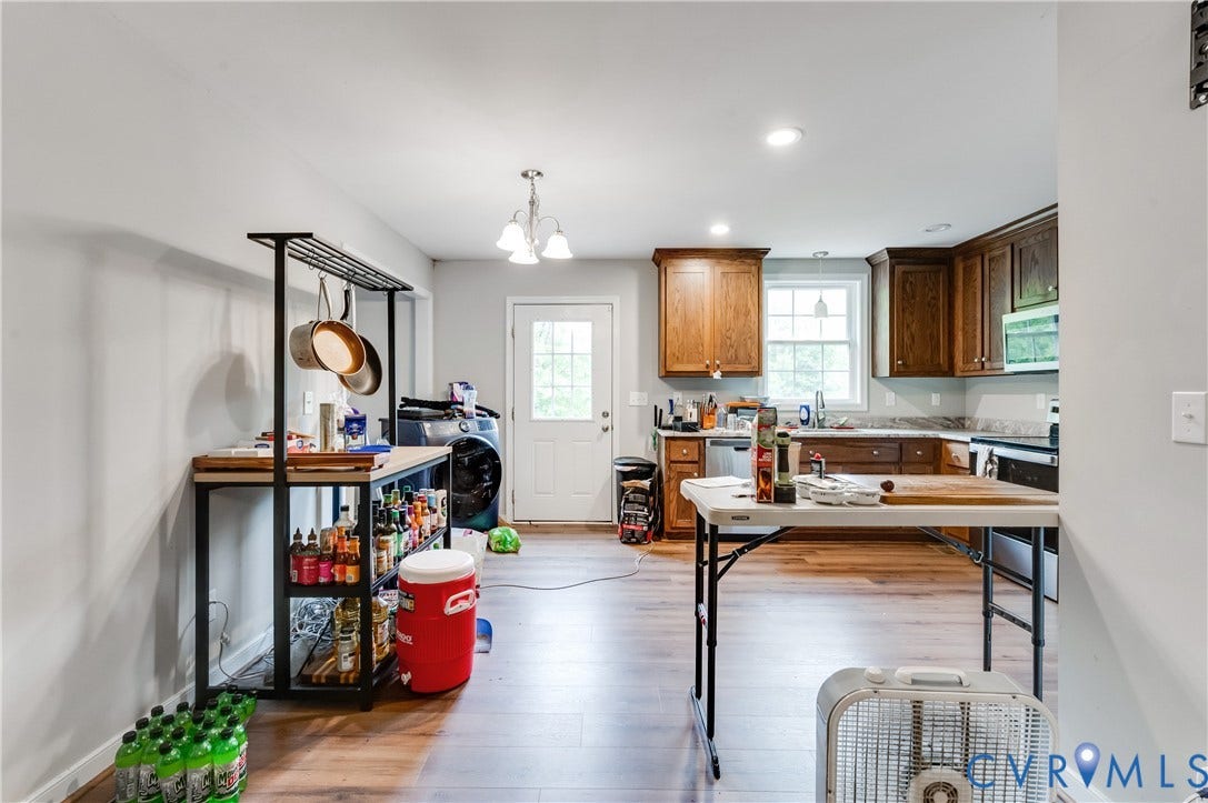 24580 St James Road, Amelia, VA 23083 Open-concept kitchen featuring wood-finish flooring, recessed lighting, and a white paneled door