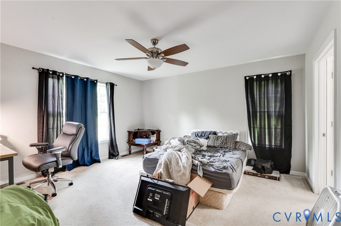 24580 St James Road, Amelia, VA 23083 Bedroom featuring light gray wall paint, white trim, two windows, wall-to-wall carpeting, and a ceiling fan