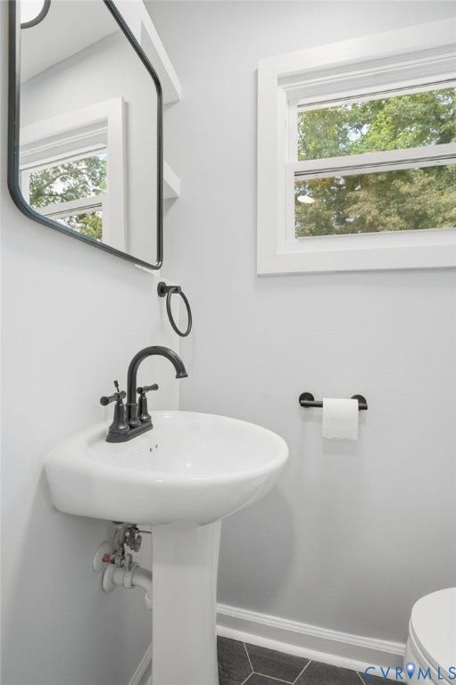 6929 Woodrow Terrace, Richmond, VA 23228 Pedestal sink with dark bronze faucet and hardware