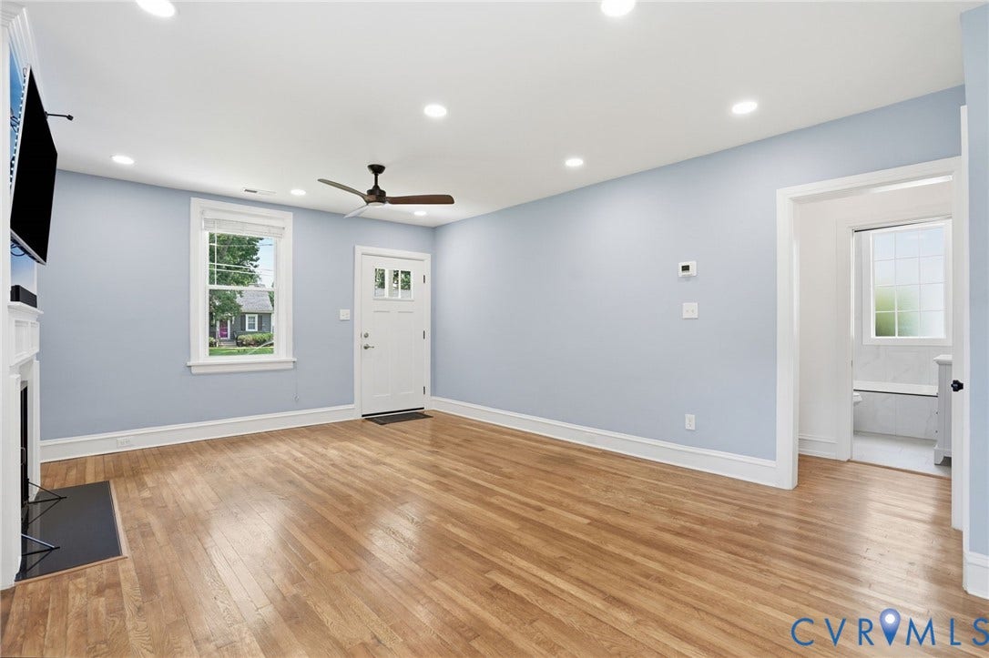 6929 Woodrow Terrace, Richmond, VA 23228 Spacious living area featuring wood-finish flooring, recessed lighting, and a ceiling fan