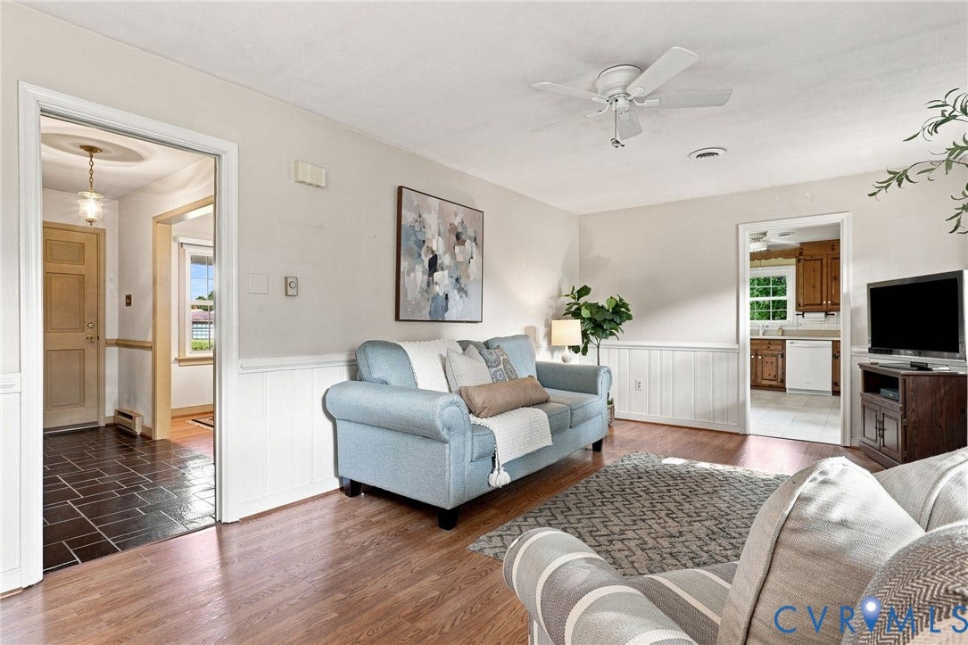4001 Saldale Drive, North Chesterfield, VA 23237 Recessed window with white trim, chair rail molding, a brass-finish chandelier, and wood-finish flooring