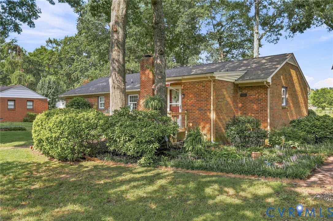 4001 Saldale Drive, North Chesterfield, VA 23237 Covered front porch featuring a paneled ceiling, brick wall, vinyl siding, and a multi-pane entry door
