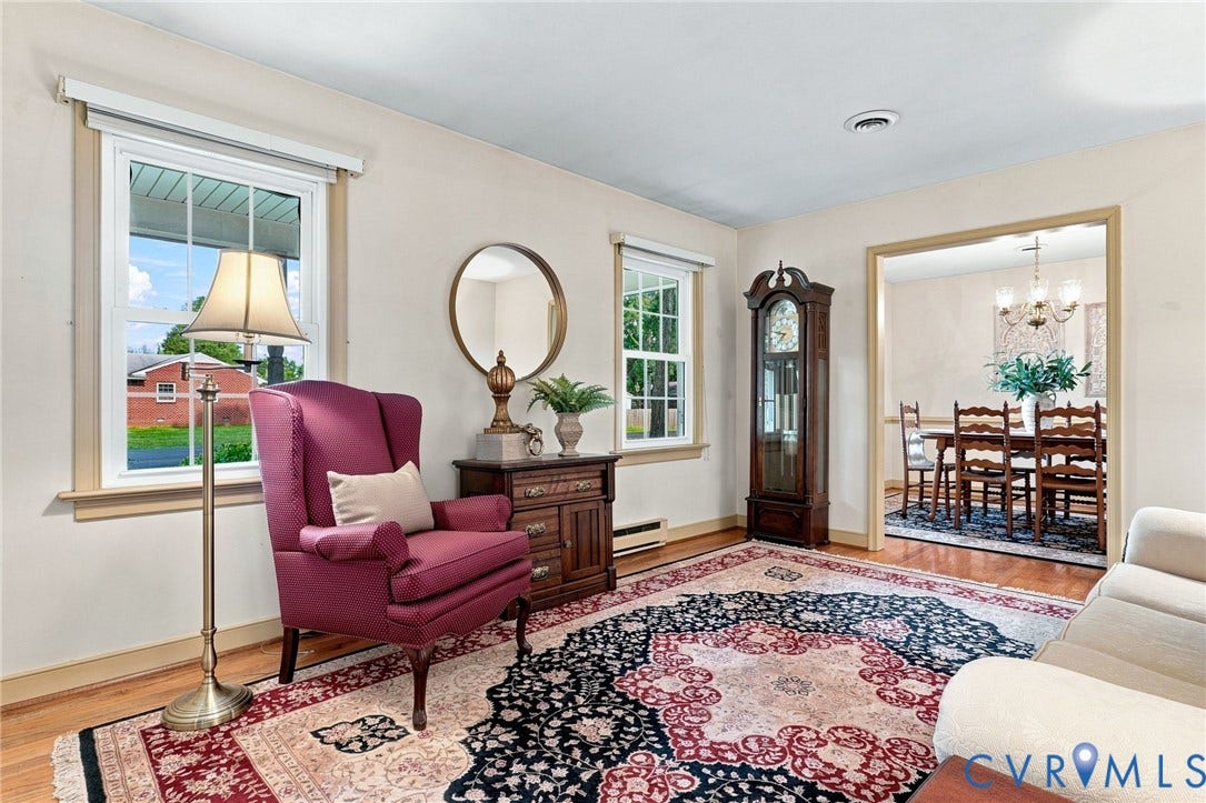 4001 Saldale Drive, North Chesterfield, VA 23237 Ceiling fan with wood-finish blades, recessed closet with bifold doors, and wood-finish flooring