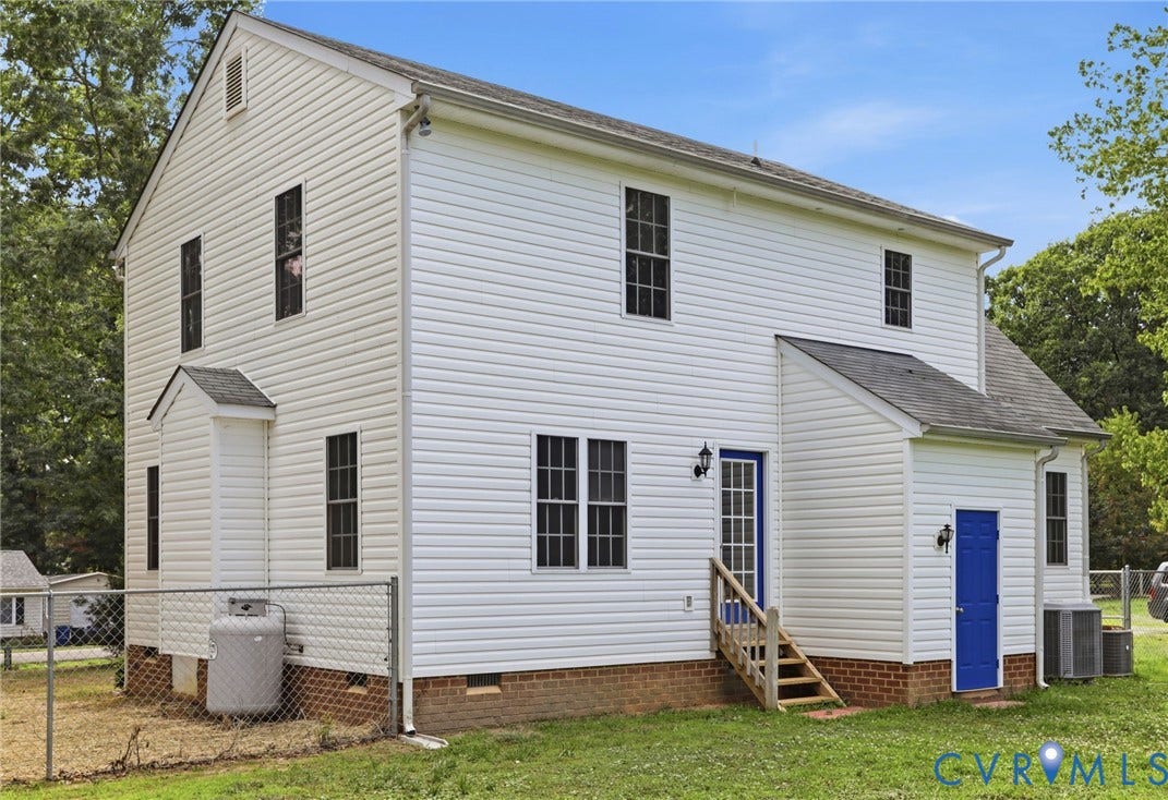 White vinyl siding exterior with two distinct bright blue entry doors