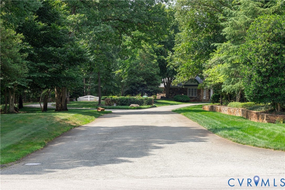 2005 Wilkhaven Terrace, Powhatan, VA 23139 Entrance- Asphalt driveway framed by manicured lawns and mature trees