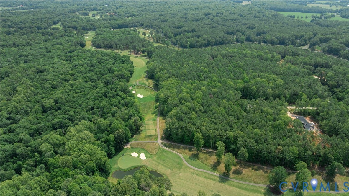 2005 Wilkhaven Terrace, Powhatan, VA 23139 Expansive golf course setting featuring manicured greens, sand traps, and water features, surrounded by mature tree lines