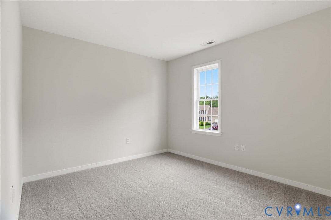 6412 Autumn Mist Way, Chesterfield, VA 23832 Bright interior space featuring light gray wall paint, neutral gray carpet flooring, and white baseboards