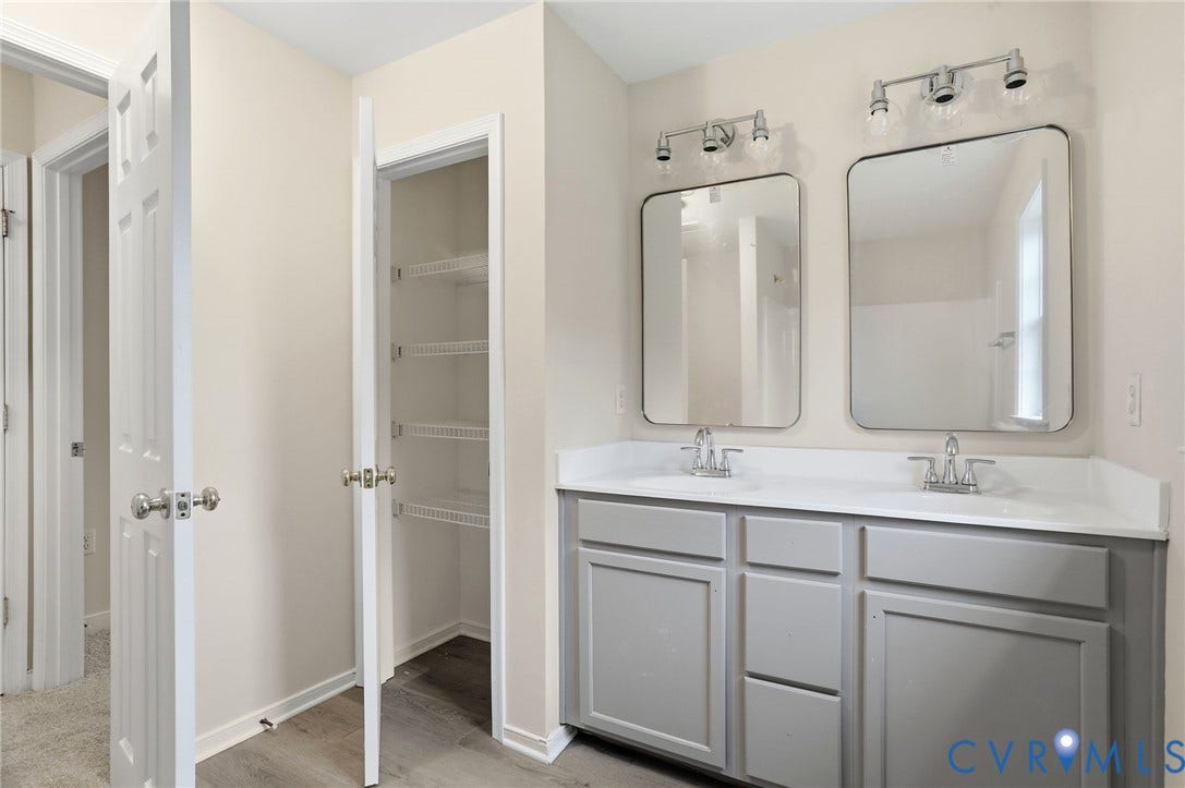 6412 Autumn Mist Way, Chesterfield, VA 23832 Dual vanity with gray cabinetry, white countertops, and chrome fixtures