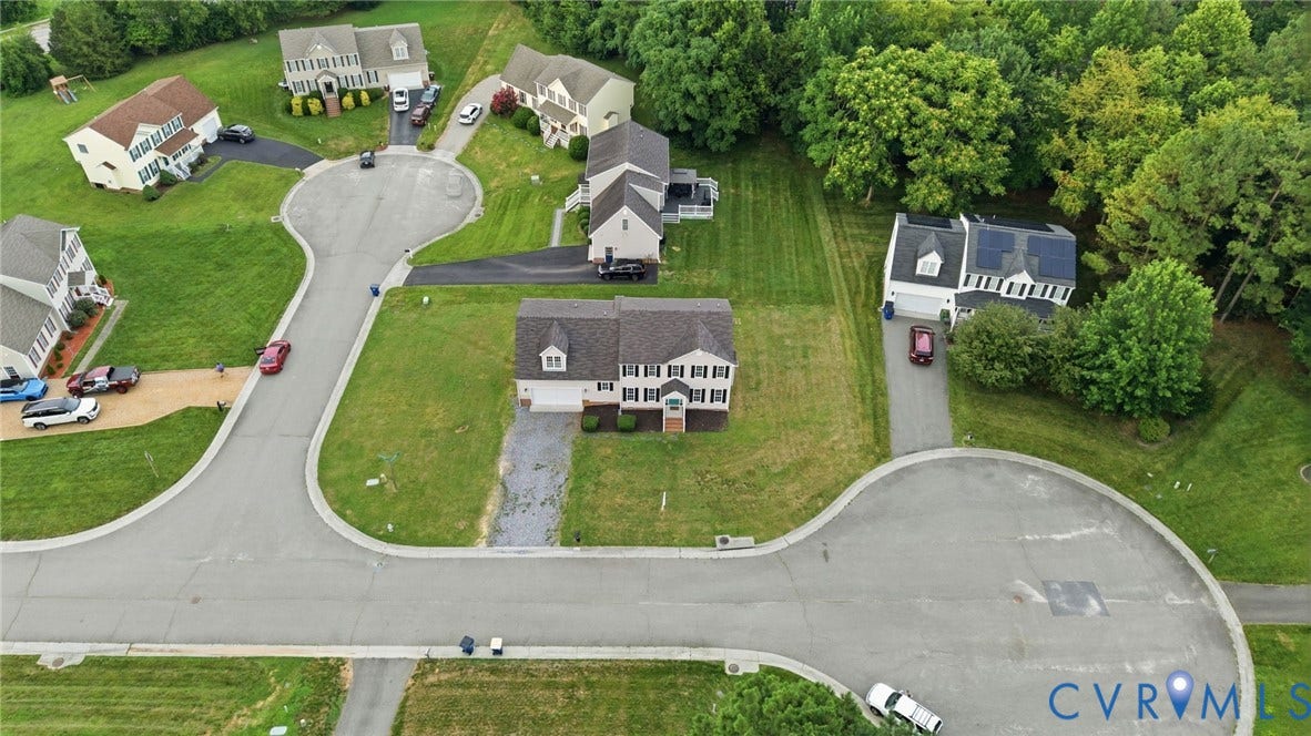 6412 Autumn Mist Way, Chesterfield, VA 23832 Colonial-style residence featuring a dormer roof, attached garage, and prominent front entry