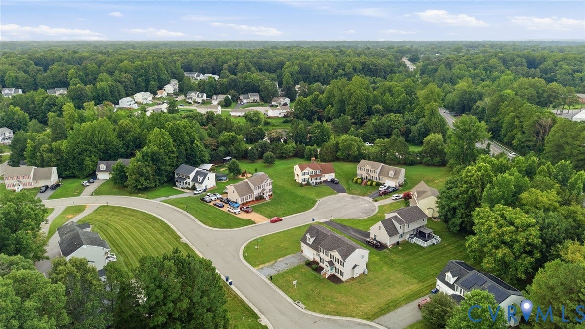 6412 Autumn Mist Way, Chesterfield, VA 23832 Aerial perspective showcasing a residential community surrounded by extensive mature tree cover