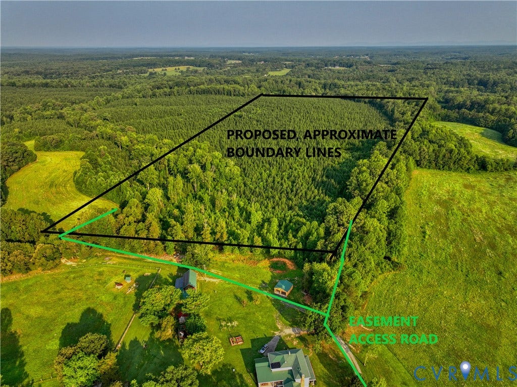 Expansive land parcel featuring substantial wooded areas and open fields