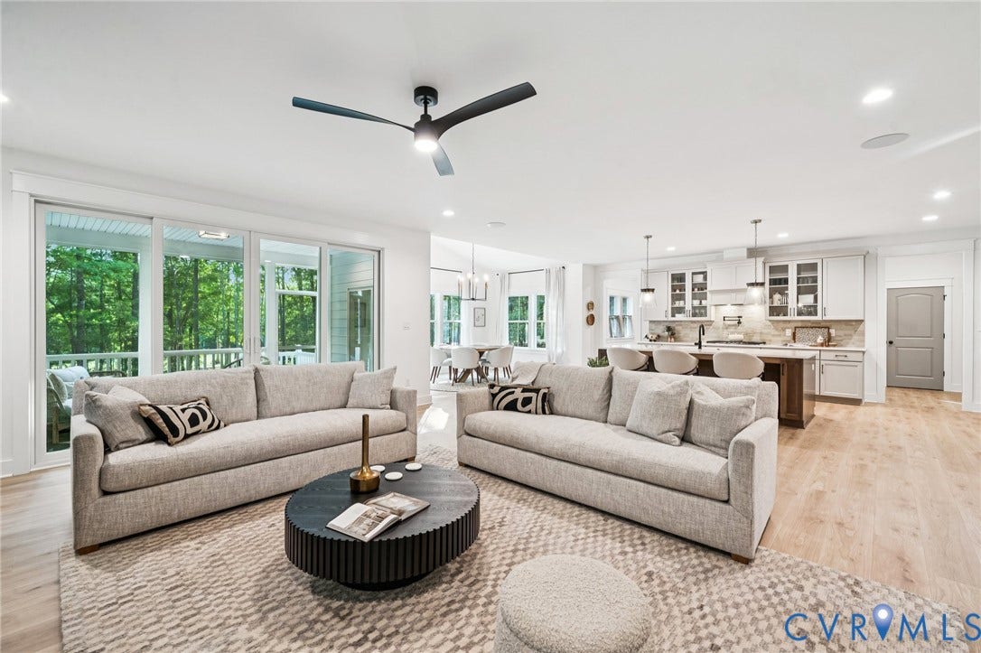 9156 Terroir Lane, Viniterra Villas, New Kent, VA 23124 Open-concept living space featuring wood-finish flooring, recessed lighting, and a modern ceiling fan