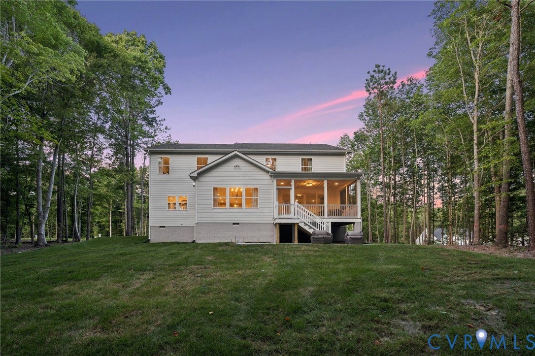 9156 Terroir Lane, Viniterra Villas, New Kent, VA 23124 Expansive backyard featuring a manicured lawn, screened porch, and mature trees