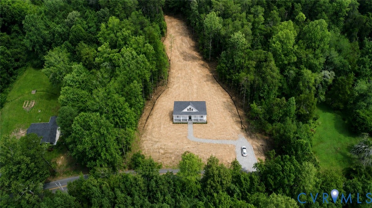 725 Goldmine Road, Louisa, VA 23093 Estimated House Location AI-New construction residence with an expansive surrounding land, a graveled driveway, and a welcoming front porch
