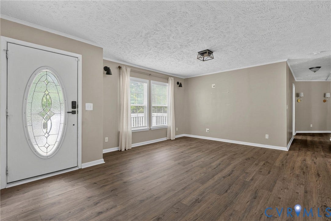 4106 S Spotswood Trail, Trevilians, Louisa, VA 22942 Spacious interior featuring wood-finish flooring, neutral wall tones, and white trim
