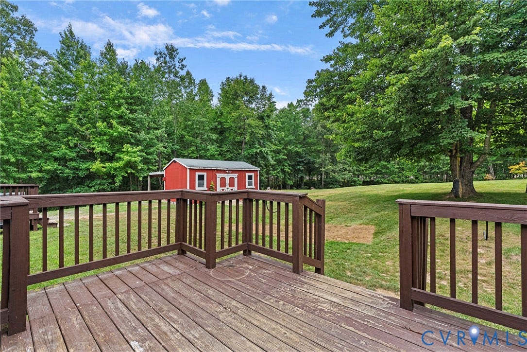 4106 S Spotswood Trail, Trevilians, Louisa, VA 22942 Wood-finish deck with dark brown railings overlooking a spacious grassy area