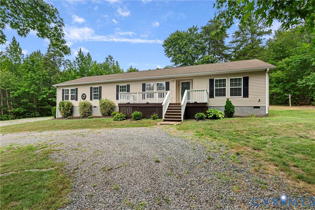 4106 S Spotswood Trail, Trevilians, Louisa, VA 22942 Single-story residence featuring light-colored siding, dark shutters, and a brown shingled roof