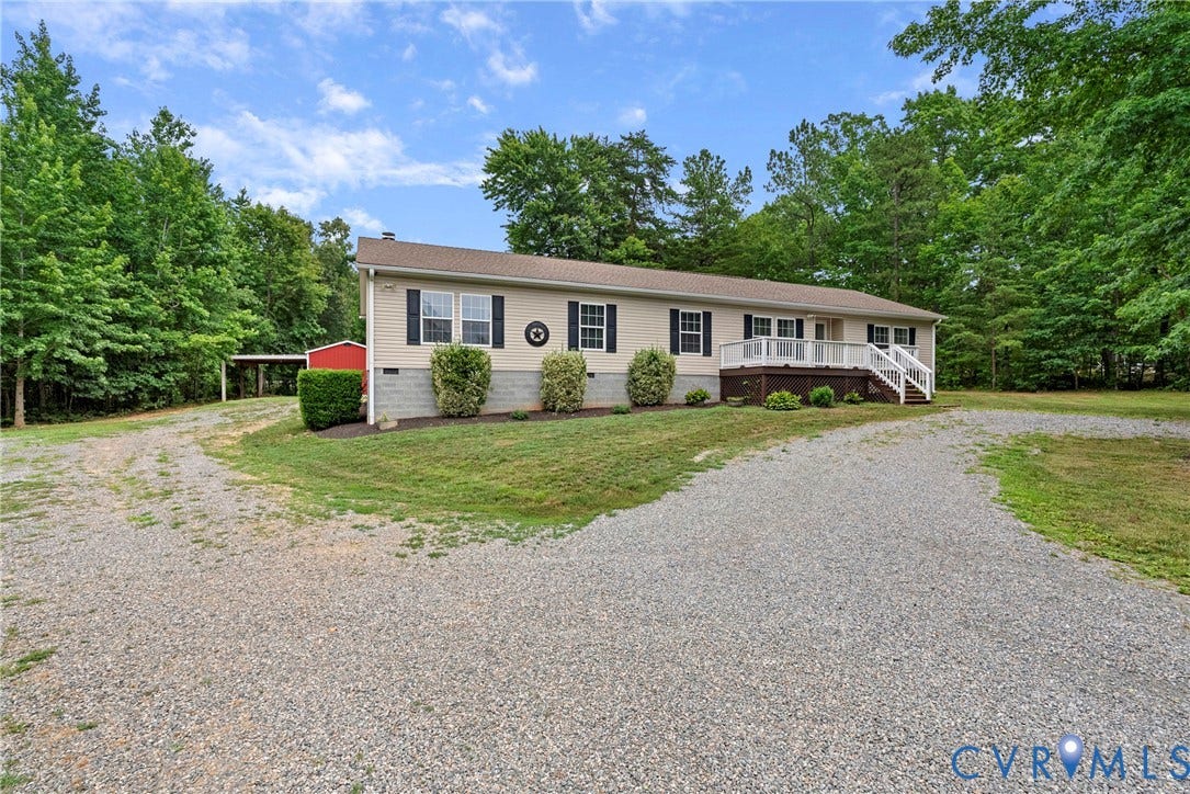 4106 S Spotswood Trail, Trevilians, Louisa, VA 22942 Ranch-style residence featuring a gravel driveway, mature trees, and a covered front porch with white railings