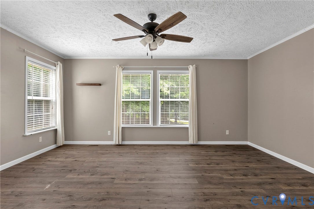 4106 S Spotswood Trail, Trevilians, Louisa, VA 22942 Spacious room featuring wood-finish flooring, neutral-toned walls, and white trim