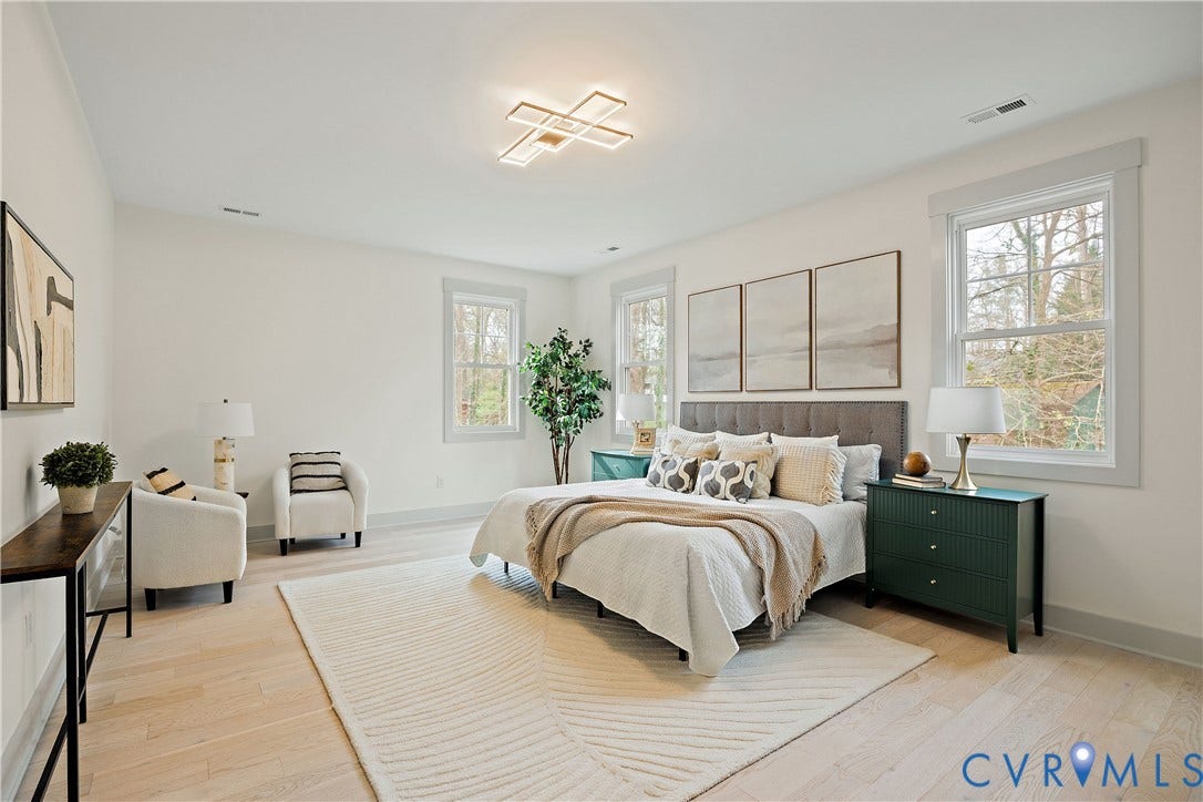 8919 Rustic Road, Richmond, VA 23235 2nd floor primary bedroom featuring light wood-finish flooring, a modern ceiling light fixture, walk-in closet & en-suite bathroom