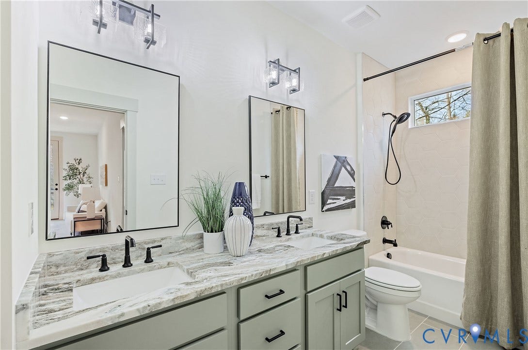 8919 Rustic Road, Richmond, VA 23235 Full hall bathroom on the 2nd floor. Double vanity with stone countertop and tub/shower combo