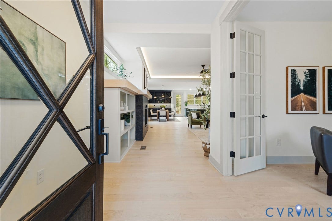 8919 Rustic Road, Richmond, VA 23235 Arched entry door with decorative glass panels and dark wood finish