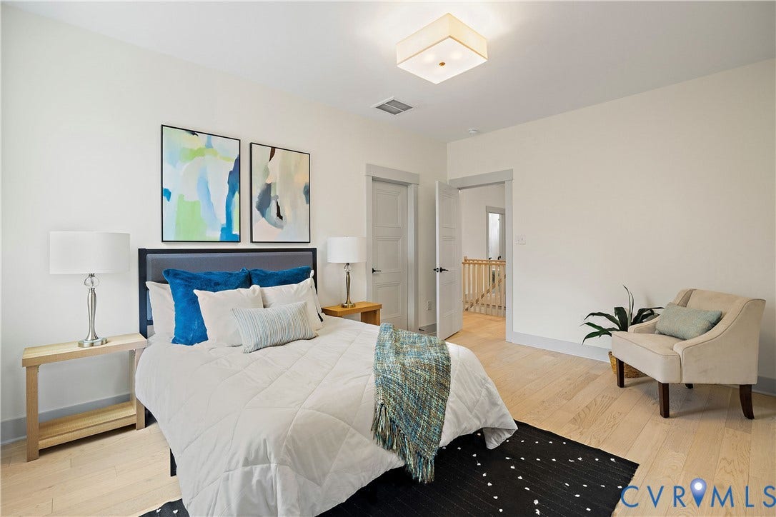 8919 Rustic Road, Richmond, VA 23235 Bedroom 2, 2nd floor featuring light wood-finish flooring, white walls, and a contemporary ceiling light fixture