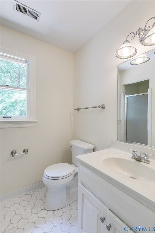 The third full bath upstairs, en suite to the 5th bedroom.