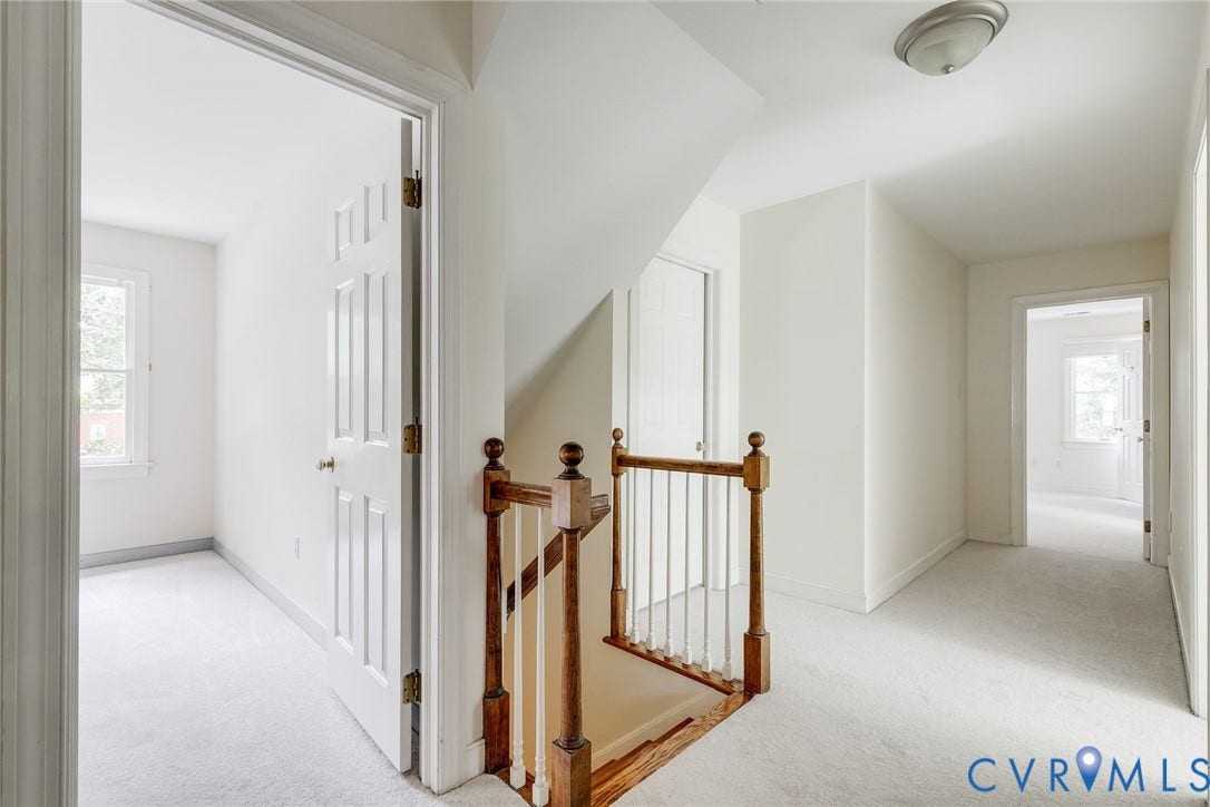 New carpet in the spacious upstairs hallway.