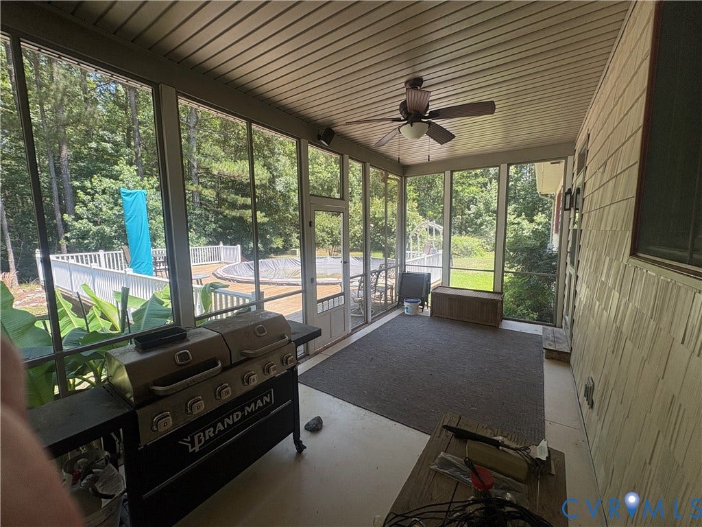 Screened porch with ceiling fan and exterior siding