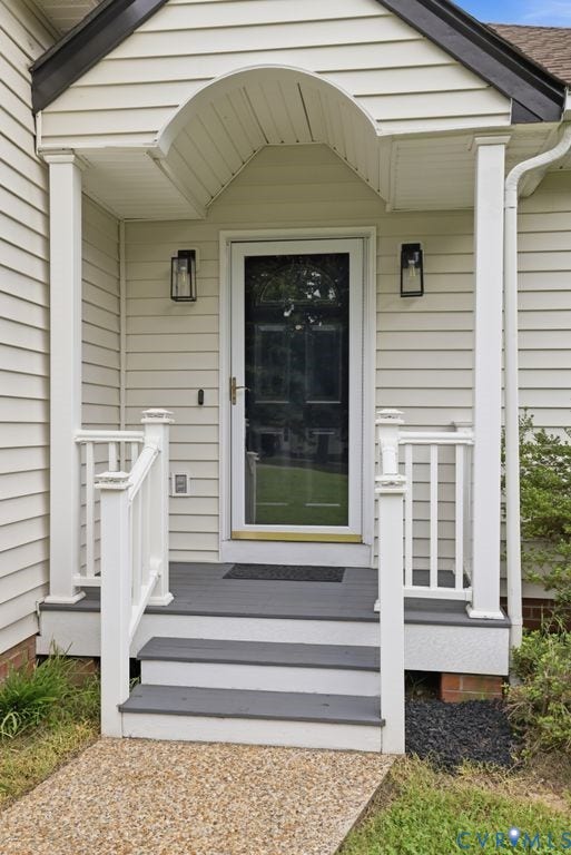 3819 Daniels Street, Chesterfield, VA 23831 Front entry featuring a storm door, sheltered porch, and stone-finish walkway