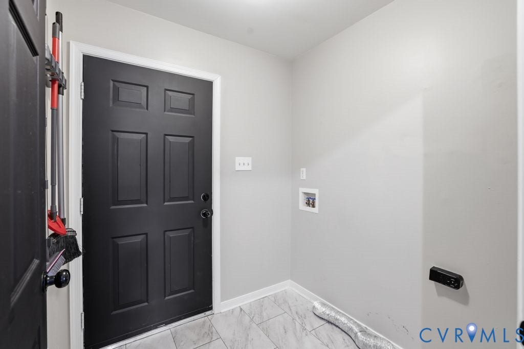 3819 Daniels Street, Chesterfield, VA 23831 Utility area featuring light gray walls, a six-panel black door with white trim, and light-toned tile flooring