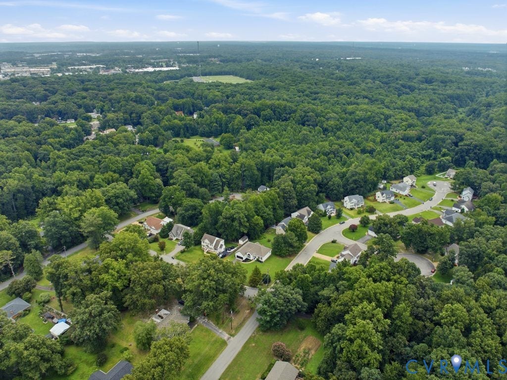 3819 Daniels Street, Chesterfield, VA 23831 Aerial perspective showcasing a residential community enveloped by extensive tree coverage