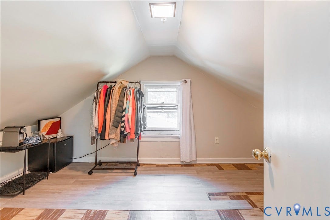 4404 Patterson Avenue, Richmond, VA 23221 Attic space featuring sloped ceilings, a single window, and light wood-finish flooring