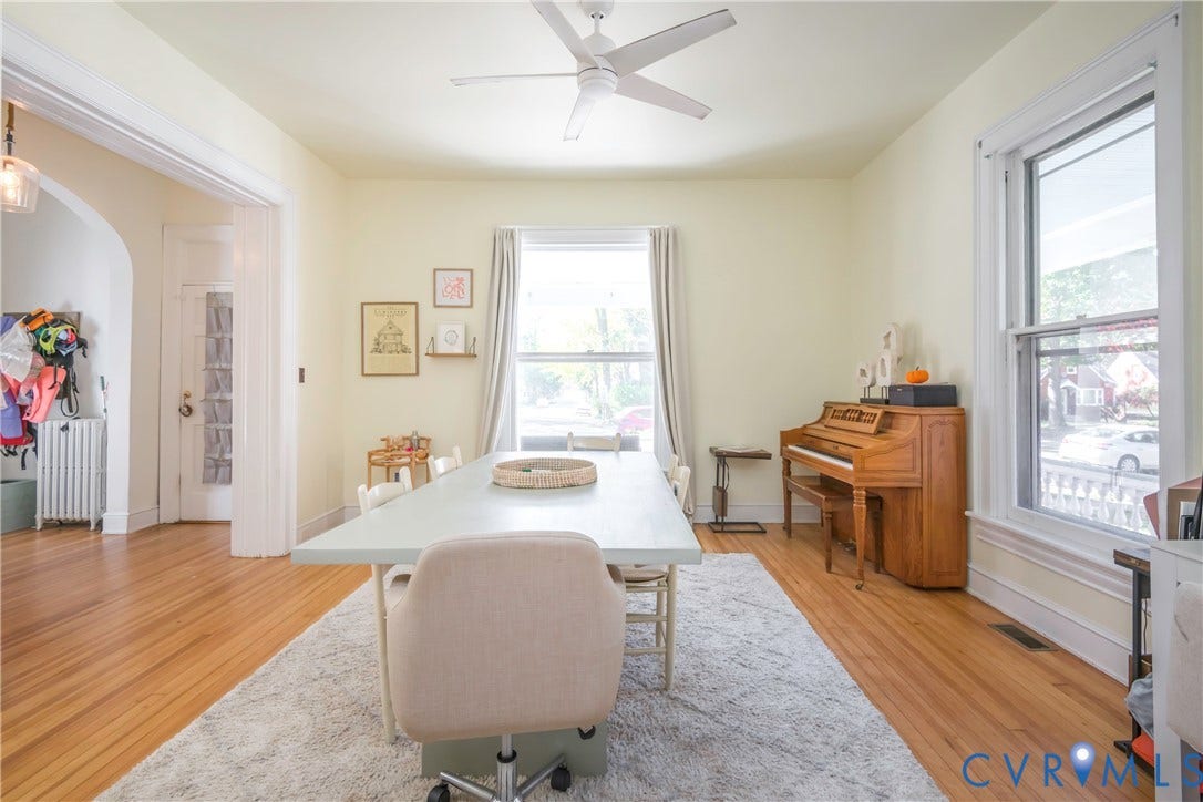4404 Patterson Avenue, Richmond, VA 23221 Bright interior space featuring wood-finish flooring, a contemporary ceiling fan, and large windows with white trim