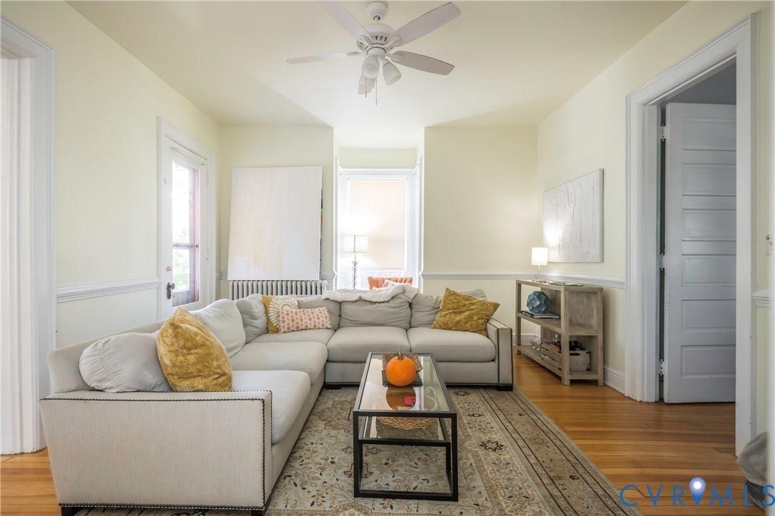 4404 Patterson Avenue, Richmond, VA 23221 Living area featuring hardwood flooring, a ceiling fan, crown molding, and a paneled interior door