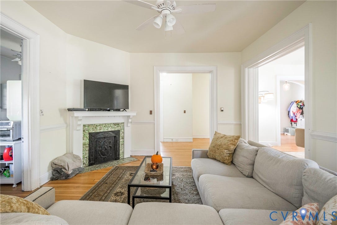 4404 Patterson Avenue, Richmond, VA 23221 Living area featuring a detailed fireplace with a green tile surround and cast iron insert