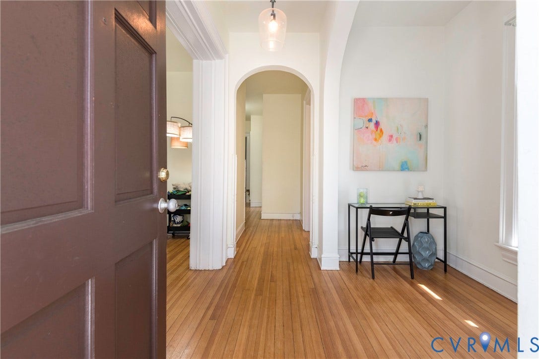 4404 Patterson Avenue, Richmond, VA 23221 Entryway featuring wood-finish flooring, white painted walls, and decorative archways