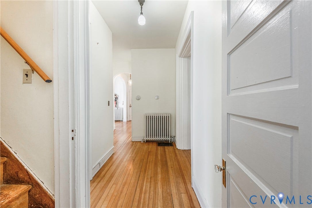 4404 Patterson Avenue, Richmond, VA 23221 Hallway featuring wood-finish flooring and white baseboards